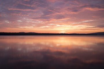 Fototapeta na wymiar Sunrise over Flagstaff Lake in Maine