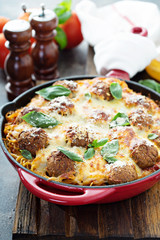 Baked meatballs with spaghetti and cheese