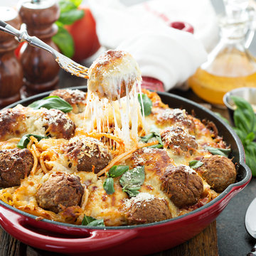 Baked meatballs with spaghetti and cheese