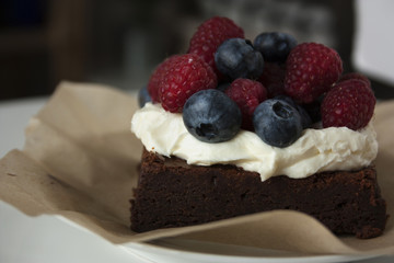 chocolate cake with berries and cream