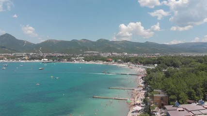 Aerial photography of the sea with boats and mountains