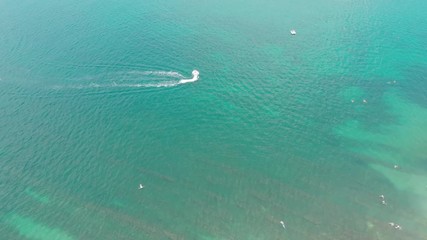 Aerial photography of the sea with boats and mountains
