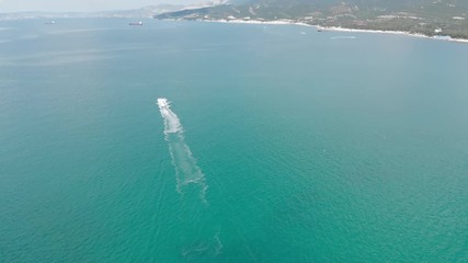Aerial photography of the sea with boats and mountains