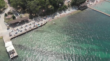 Aerial photography of the sea with boats and mountains