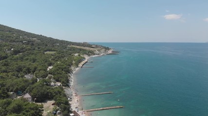 Aerial photography of the sea with boats and mountains