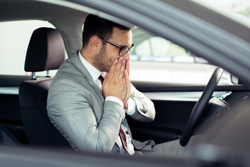 Portrait of happy customer buying new car