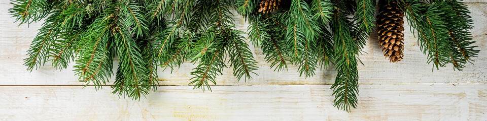 Christmas and Happy New Year holiday background with natural fir spruce, on wooden background, Winter Greeting Card  concept with copy space for text. banner