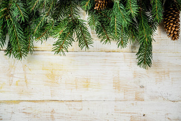 Christmas and Happy New Year holiday background with natural fir spruce, on wooden background, Winter Greeting Card  concept with copy space for text.