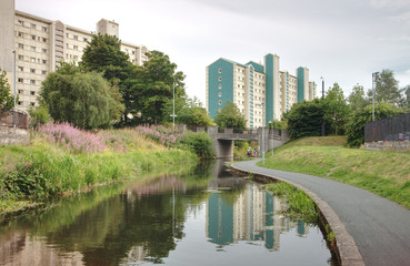 A photograph of tall residential buildings in the Wester Hail suburbs of Edinburgh, Scotland, United Kingdom near the Union Canal