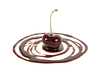 Cherry in chocolate puddle isolated on white background
