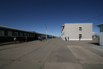 Fototapeta na wymiar On a train station platform in Mongolia, waiting to get on the transsiberian express