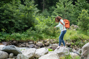 Tourist woman are hiking at the waterfall in Nature