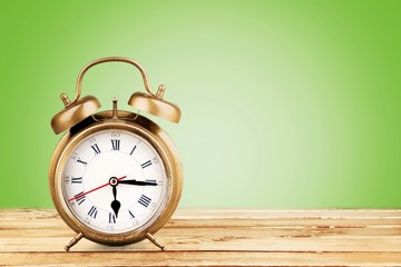 Blue Retro alarm clock on wooden table