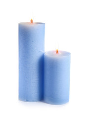 Obraz na płótnie Canvas Two decorative blue wax candles on white background