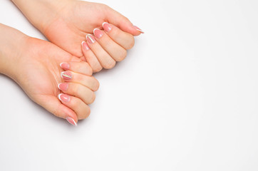 Female soft hands with beautiful french manicure. isolated white background. long nails. place for text. copy space