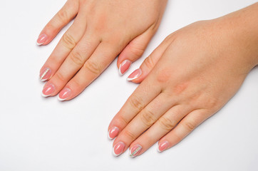 Female soft hands with beautiful french manicure. isolated white background. long nails. place for text. copy space