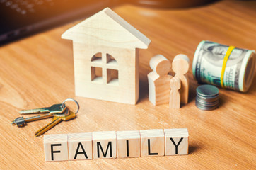 the family with money is standing near their house. concept of wealth life and a happy...