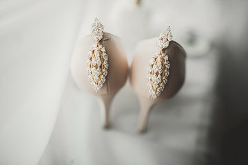 White stylish wedding shoes for bride. Close-up