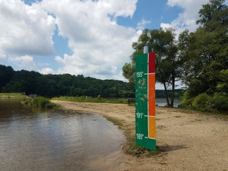 sign in park indicating flood height levels