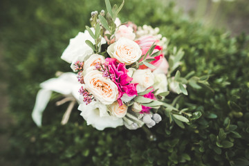 Wonderful luxury wedding bouquet of different flowers