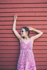 Girl on the background of a colored wall.