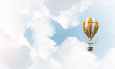 Flying hot air balloon in the air.