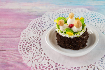 Tasty mini cake on a color gradient background