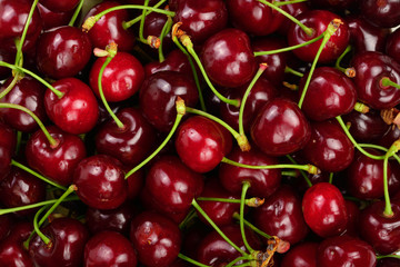 Background of ripe red cherries. Healthy eating. The texture of berries