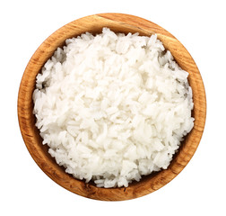 rice in a wooden bowl isolated on white background. Top view. Flat lay