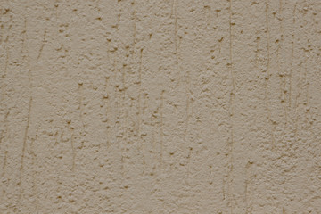 Brown plastered handmade rough wallpaper. Beautiful decorative gray plastered wall.