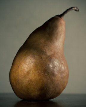 Brown Pear On Grey Background