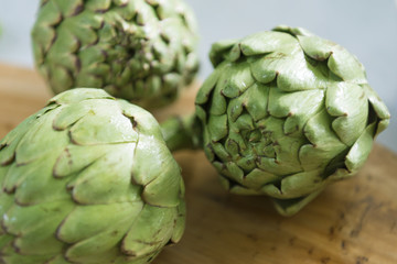 Fototapeta premium Green organic freshly harvested artichokes from the garden vegan food