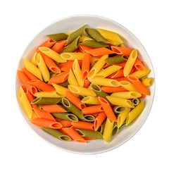 Tri color pasta penne in white bowl on white isolated background. Top view.