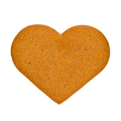 Fototapeta premium Gingerbread cookies in the form of heart, isolated on a white background. Souvenir for Valentine's Day.