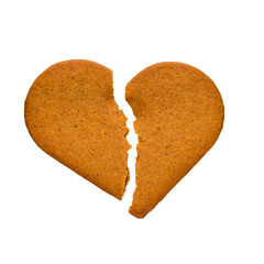 Gingerbread cookies in the form of broken heart, isolated on a white background.