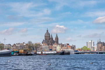 Fototapeta na wymiar Amsterdam skyline with Basilica of St. Nicholas, Netherlands