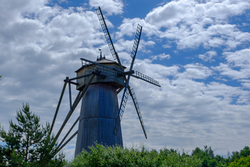 Landscape with Old wooden windmill.