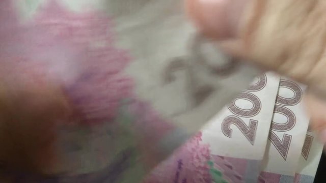 Bunch of Ukrainian money - 200 grivna bills. Money of Ukraine - hryvnia