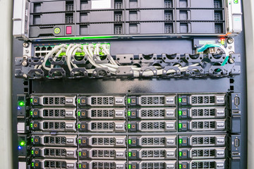 Modern database servers are connected to the switch in the server room rack. Hosting of popular...