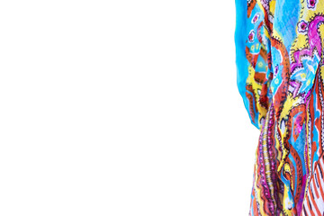 Background with colorful scarf to one side and the rest of the image colorfully blurred - selective focus - room for copy
