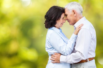 Fototapeta premium Portrait of happy senior couple smiling