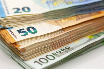 Pile of Euro Banknotes, isolated close-up on white background