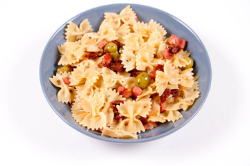 Farfalle pasta with sun dried tomato, ham and olives