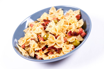 Farfalle pasta with sun dried tomato, ham and olives