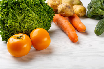 Rainbow colored fruits and vegetables on a white table. Juice and smoothie ingredients. Healthy eating