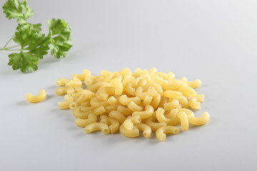 pasta elbows on a light background