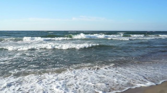 Baltic Sea - water waves. Beautiful blue sky and turbulent sea