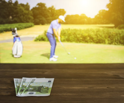 Euro Money Against The Backdrop Of A TV On Which Golf Is Shown, Sports Betting, Golf Euro