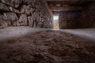 Fototapeta na wymiar Interior of a house at Pucara de Tilcara old pre-inca ruins - Tilcara, Jujuy, Argentina