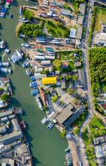 aerial at Phuket fishing port and Phuket shipyard. Phuket Fishing Port is the largest fishing port .located in Sirey Island next to Phuket Island. There is a large canal leading to the sea.